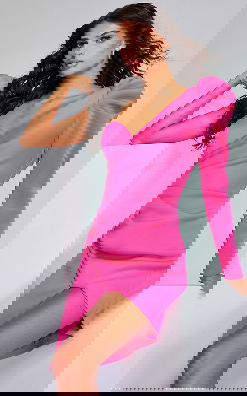 model wearing 42632 pink dress with asymmetrical design and puffed sleeve