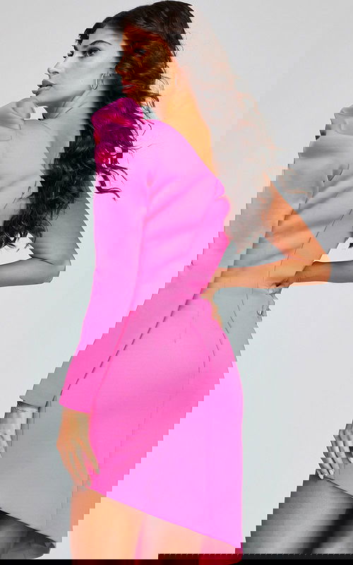 back view of model wearing 42632 pink dress with puffed shoulder