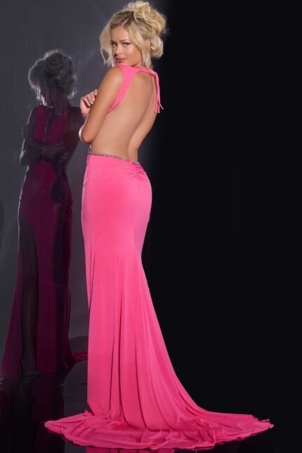 Back view of model in Jovani 42675 hot pink gown with open back and elegant train.