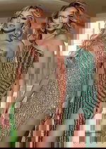 Two models wearing Jovani 42677 gowns in green and gold, with high slits and sequins