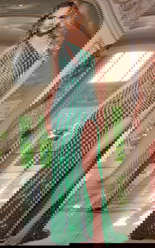 Model wearing Jovani 42677 green gown with sequined pattern and high slit from the front