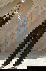 Halter neck sequin jumpsuit with deep V neckline and fitted waist