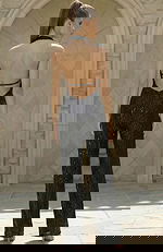 Back view of open back sequin jumpsuit with straight leg design