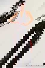 Glamorous beaded jumpsuit with deep neckline and high side slits