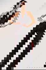 Sparkling halter jumpsuit with beaded fabric and open back