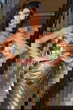 Shiny gold fitted evening gown with structured bodice and slit skirt