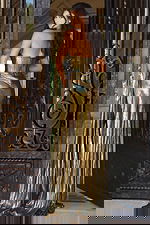 Backless metallic gown with corset top and floor-length design