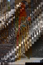 Gold formal dress with ruched bust and sleek high-slit silhouette