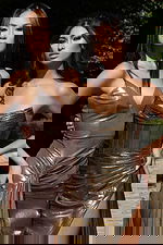 Shiny metallic evening gowns with thigh-high slits and elegant floor-length hems