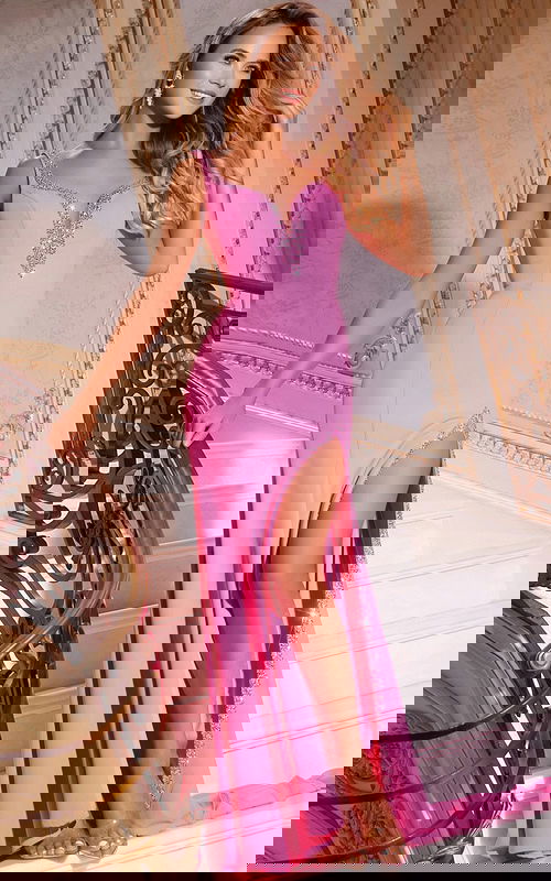 Model wearing Jovani 42899 pink gown with deep V-neckline and high slit.