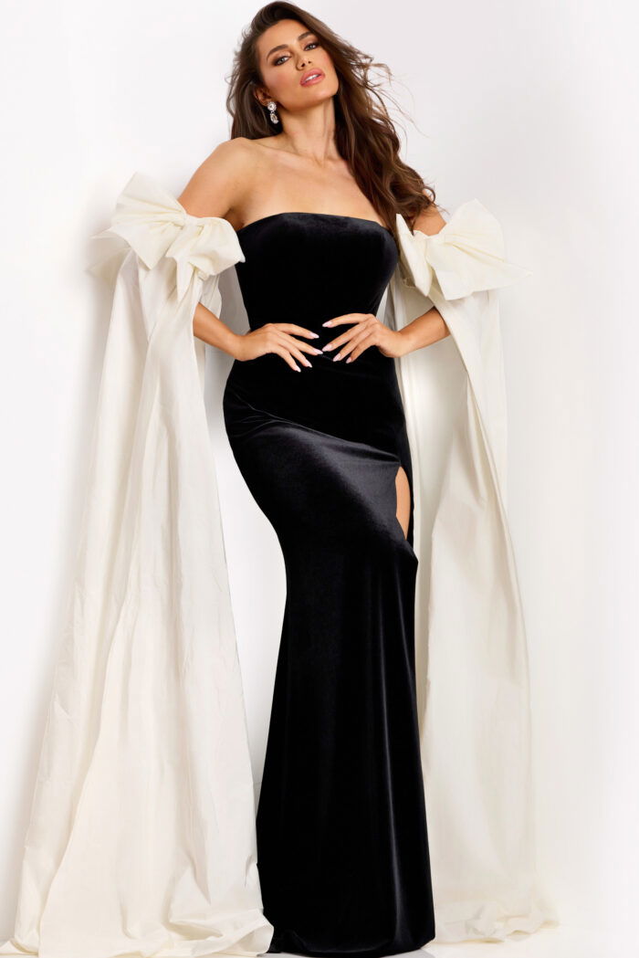 Strapless velvet gown with high slit and ivory cape