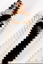 Strapless velvet gown with high slit and ivory cape