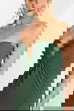 Side view of sleek strapless green gown in jersey fabric