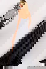 Black evening dress featuring thigh-high slit and side bow detail