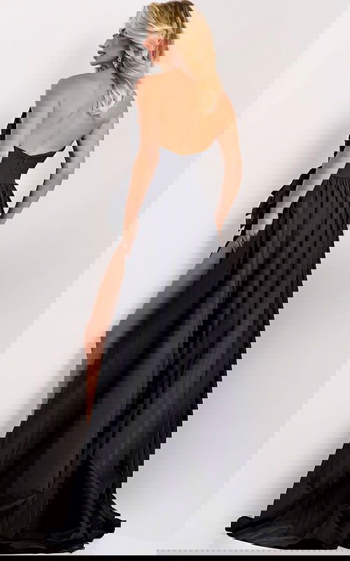 Black evening dress featuring thigh-high slit and side bow detail