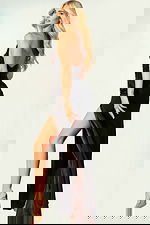 Floor-length black gown with ruched skirt and embellished corset bodice