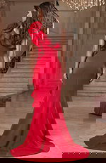 Back view of fitted gown with one shoulder ruffle and flowing train