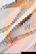 close up of soft pink tweed party dress