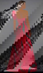 Strapless gown with dramatic red and black abstract pattern and statement shoulder bow