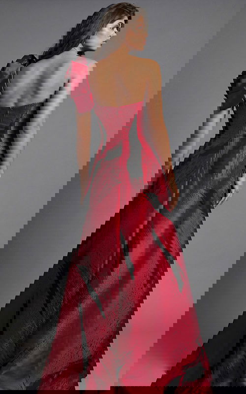 Strapless gown with dramatic red and black abstract pattern and statement shoulder bow