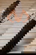 Sheer beaded gown with V neckline and fitted silhouette