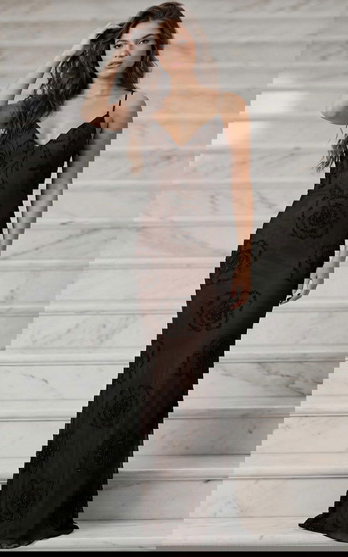 Front view of fitted evening gown with delicate straps and beadwork