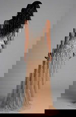 Back view of beaded gown with sheer train and fitted silhouette