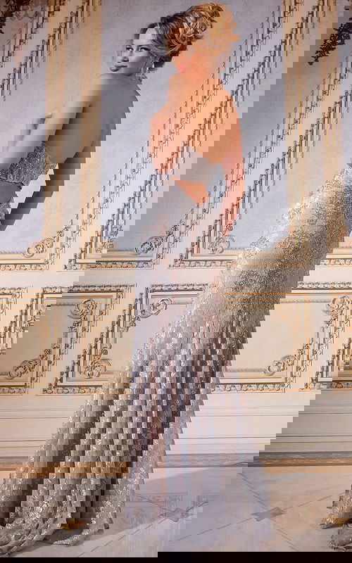 Model in Jovani 43098 gown showing open back and lace detailing, back view.