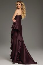 Back view of model in Jovani 43126 dress featuring cascading ruffles in brown.
