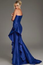 Model showing back of Jovani 43126 dress, cascading ruffle detail in purple.