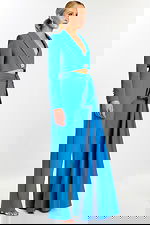 Side view of peacock blue pantsuit with satin sash and rhinestone button