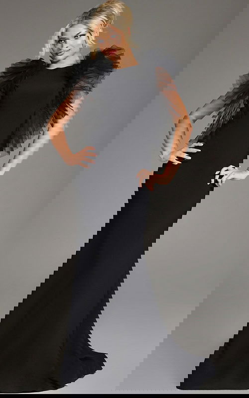 Model wearing Jovani 43153 black dress with flutter sleeves, front view.