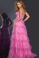 Model wearing Jovani 43170 pink dress, back view showing layered tulle.