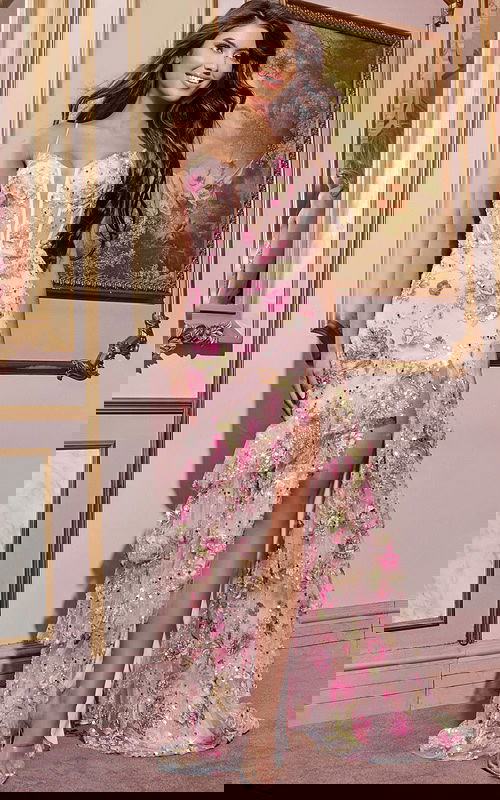 Model wearing Jovani 43172 pink dress featuring floral embellishments and high slit