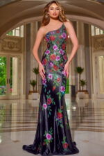 Model wearing Jovani 43194 black gown with floral embellishments from the front.