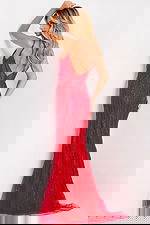 Fitted red gown with open back and sparkling beadwork