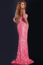 Model wearing Jovani 43334 pink dress showing back view with sequin detail