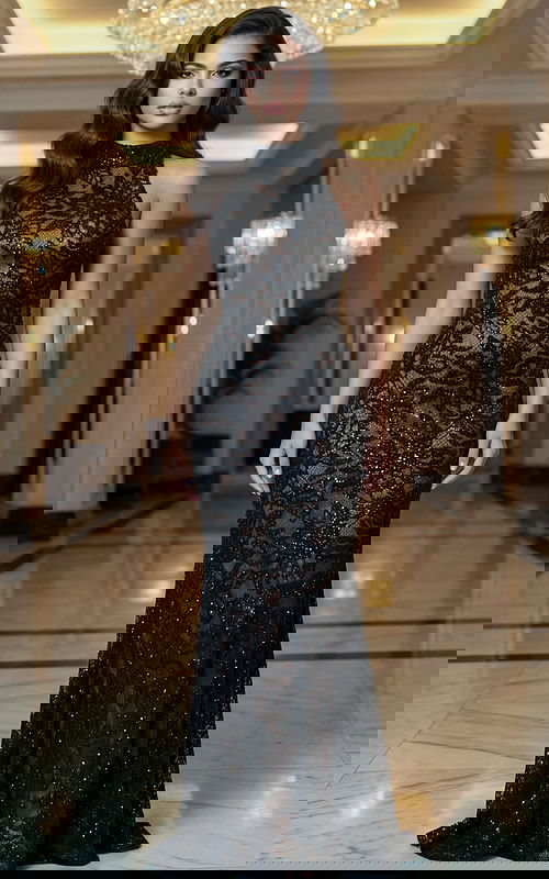 Elegant fitted evening gown with sheer lace detailing