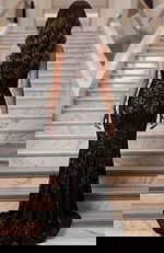 Back view of lace gown with smooth fitted shape and subtle sparkle