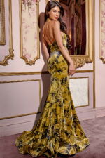 Model wearing Jovani 43388 green dress, showcasing backless design and graceful train, back view.