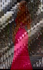 Back view of strapless satin evening dress with beaded bodice, ruched waist detail, and fitted skir