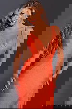 Close-up of model in Jovani 43573 orange gown highlighting V-neck design.