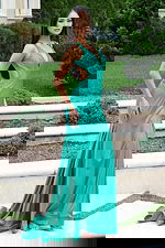 Green shimmer gown with mermaid-style bottom and sleek fit