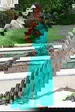 Green shimmer gown with mermaid-style bottom and sleek fit