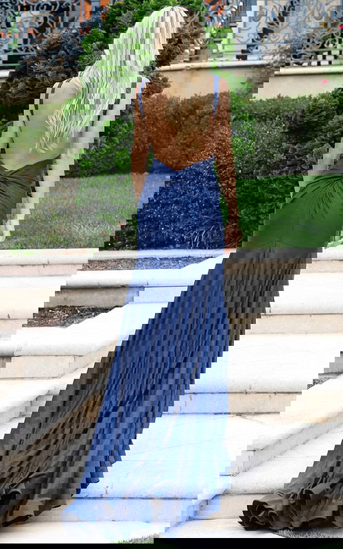 Back view of blue shimmer gown with long train and gathered detail