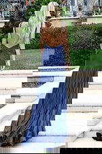 Blue shimmer gown with side slit and flowing hemline