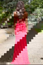 Back view of strapless red gown with beaded bodice and sleek column skirt.