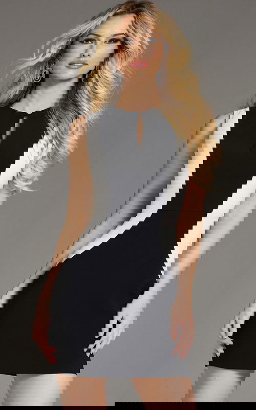 Model wearing Jovani 43593 black and white mini dress with keyhole neckline from the front.