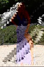 Lavender sequin gown with deep V neckline and thigh-high slit