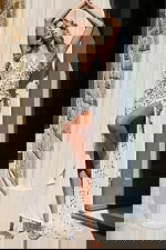 Elegant open-back sequin gown with fitted shape and long train